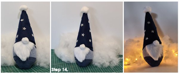 Image of the finished gonk with stars on his hat as decoration and surround by warm white fairy lights